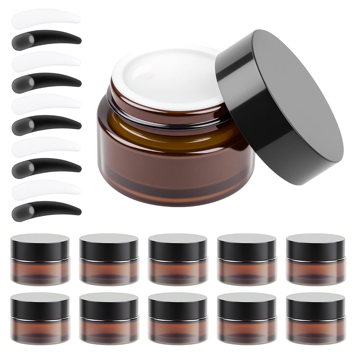 Onze petits pots en verre ambré avec couvercles et dix spatules de transfert pour les soins de voyage